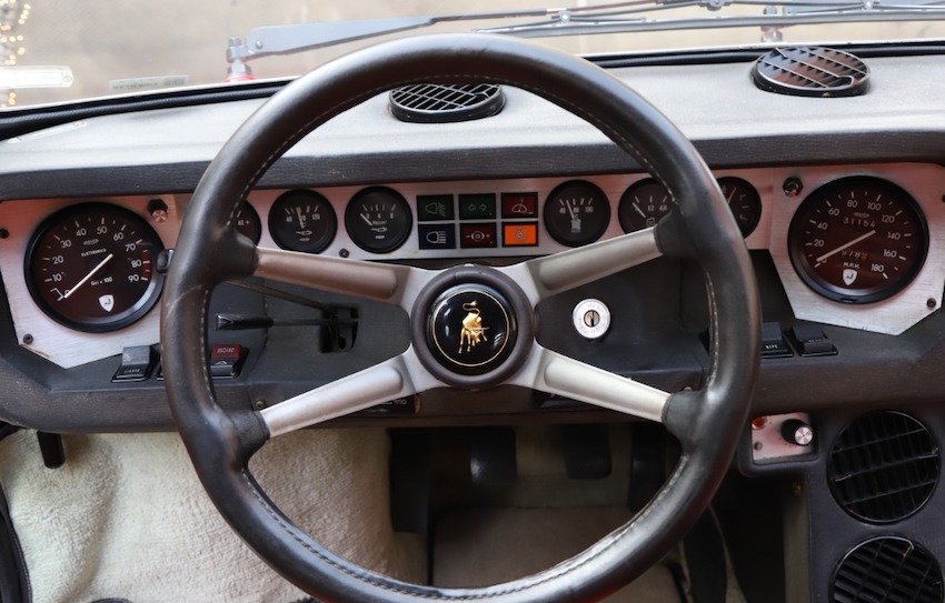 Straderial - {For sale} 1973 Lamborghini Urraco P250 S The atmosphere is  retro and the design futuristic. The steering wheel is a real work of art  and reminds one of the incredible